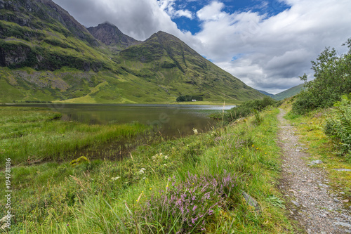 A scenic trail on the banks of Loch Achtriochtan in Glencoe valley, Highlands, Scotland, Britain
