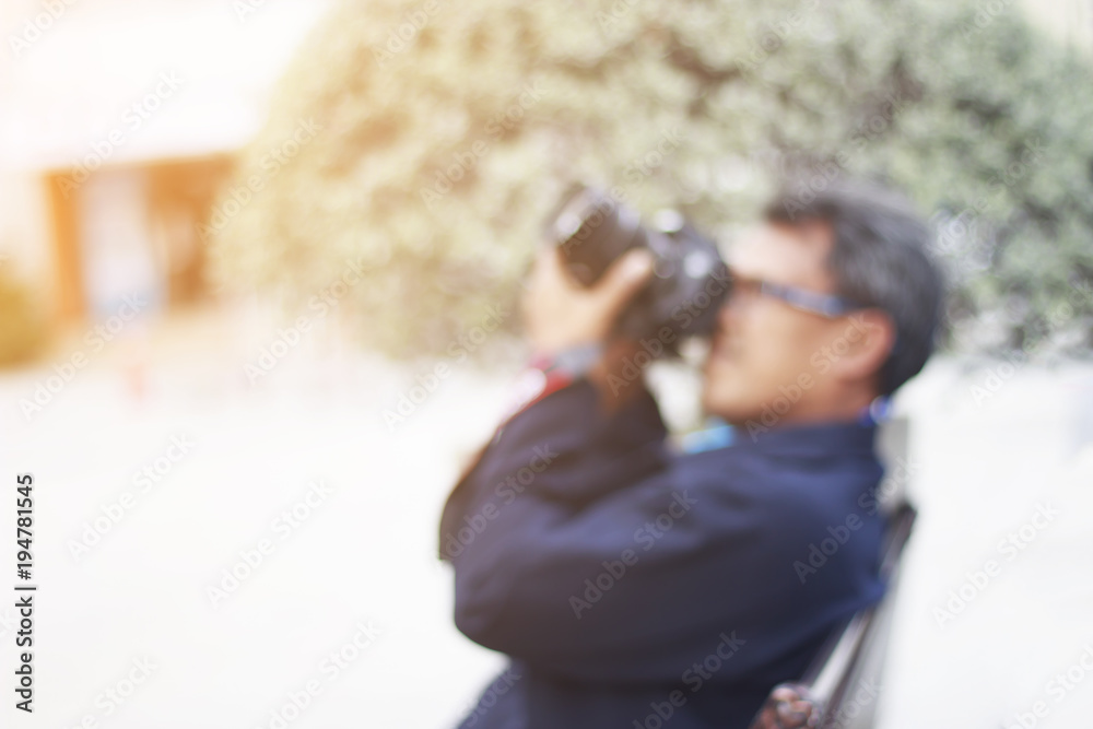 Blur of man take a photo and copy space and orange light vintage stlye Blur of man take a photo and copy space and orange light vintage stlye