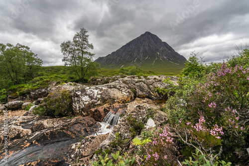 Dramatic view of River Etive falls Buachaille Etive Mor, the most famous mountain of Glencoe valley, Highlands, Scotland, Britain photo