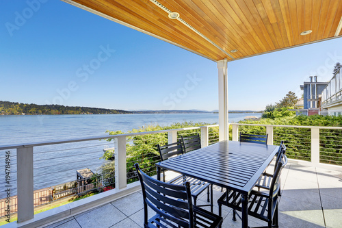 Large covered deck with comfortable outdoor dining space