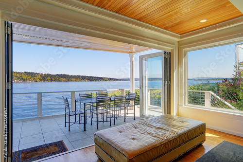 Lakefront home interior shows the covered deck