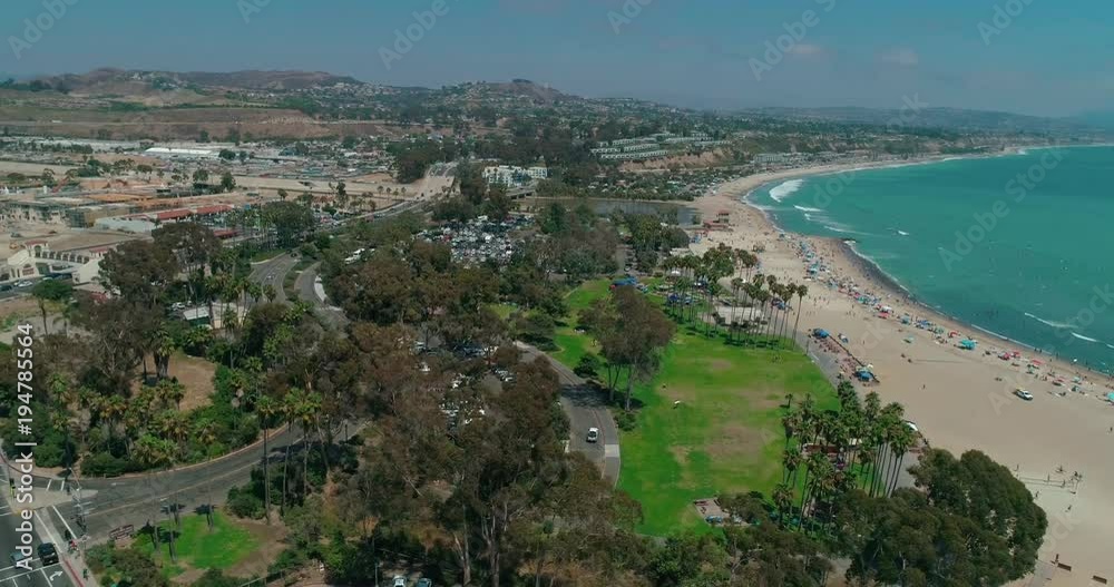 DANA POINT, California. Doheny State Beach. A sunny day beach scene with people engaged in beach activities. Surfers. Aeria 4K DANA POINT, California. Doheny State Beach. A sunny day beach scene with people engaged in beach activities. Surfers. Aeria 4K