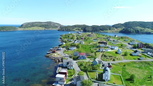 Aerial shot of beautiful historic trinity and the ocean coast in Newfoundland photo