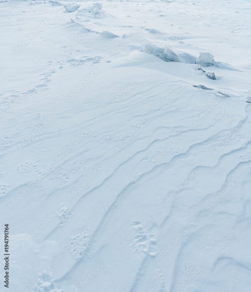 White snow pattern covered on frozen lake