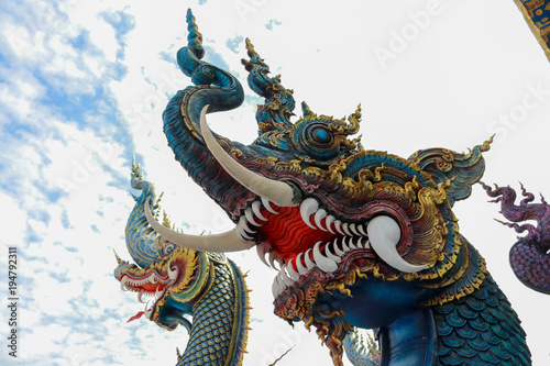 Blue Serpent Statue, Statues of the naga in Buddhist Temple.Chiang Rai,northern of Thailand © charupha