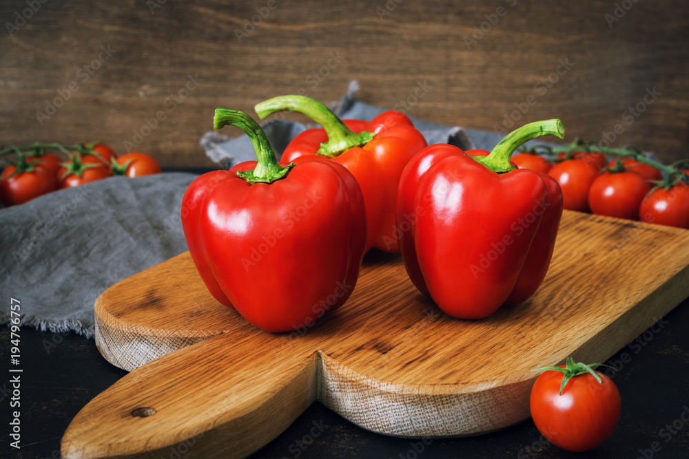 Sweet red pepper closeup on a cutting board. rustic style Sweet red pepper closeup on a cutting board. rustic style