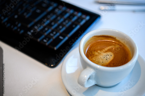 coffee on tesk with computer keyboard