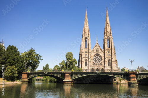 St. Paul's Church, a major Gothic Revival Lutehran church and one of the landmarks of the city of Strasbourg, in Alsace, France, with the River Ill