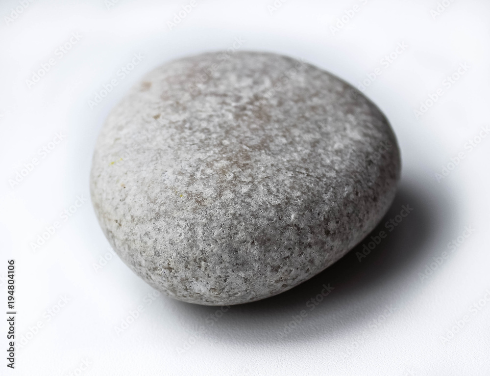 White stone on white background