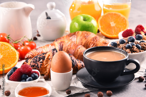 Breakfast served with coffee, juice, croissants and fruits