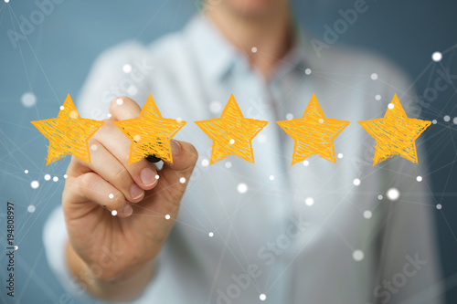 Quadro em tela Businesswoman rating with hand drawn stars