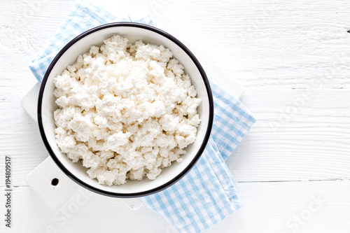 Konstfotografi Cottage cheese, curd on white wooden rustic table, top view