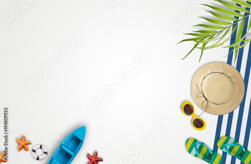 Summer vacation accessories with tropical palm leaves,  holidays abroad - summertime lifestyle objects in flat lay top view with copy space for you put your design photo
