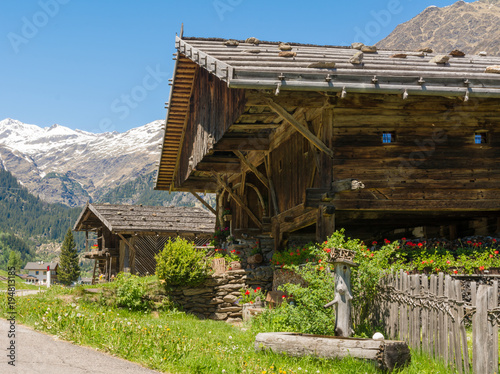 Wooden house typical in a alps village on Ridnaun Valley/Ridanna Valley - Racines country - near Sterzing/Vipiteno, South Tyrol, northern italy photo