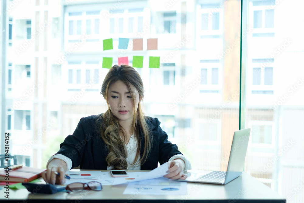 Business woman working with finance data on table. Business woman working with finance data on table.