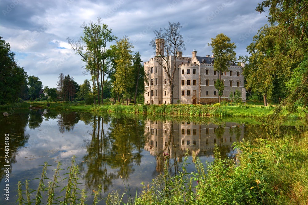 Neo-Gothic style castle surrounded by an English landscape garden in Karpniki, Poland