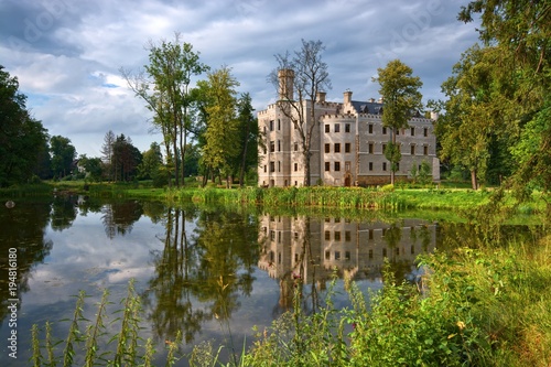 Neo-Gothic style castle surrounded by an English landscape garden in Karpniki, Poland