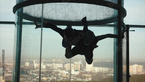 A group of persons trying the World's biggest free fall simulator, indoor skydiving Aero Gravity. Aerodynamic tube photo