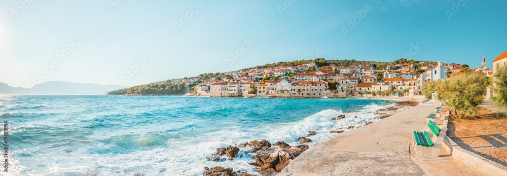Fototapeta premium Panoramic view on a beach of a small beautiful town Postira - Croatia, island Brac