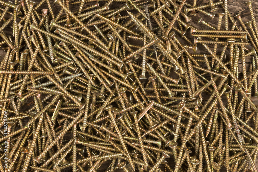 Background of golden screws. View from above. Background of golden screws. View from above.