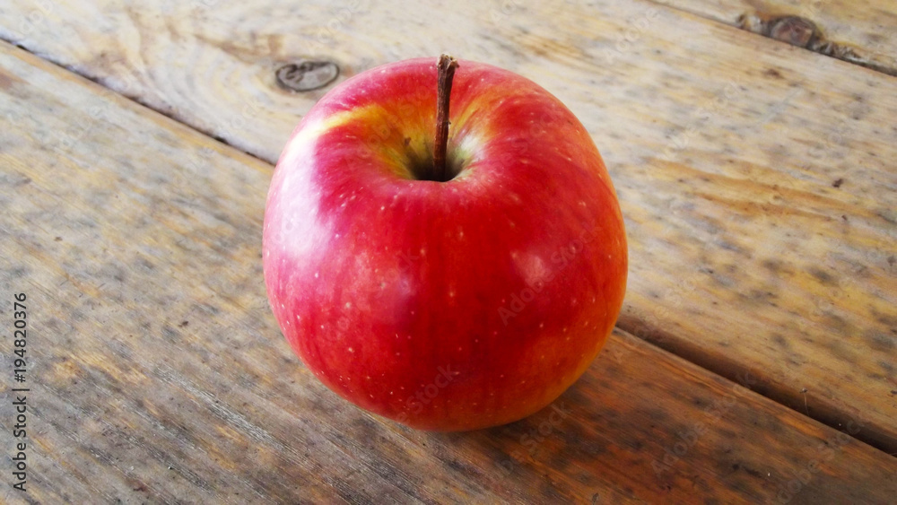 Fresh red Apple on wooden background. Fresh red Apple on wooden background.