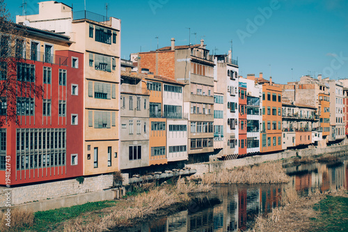 View of Girona with its picturesque river houses in a sunny day.