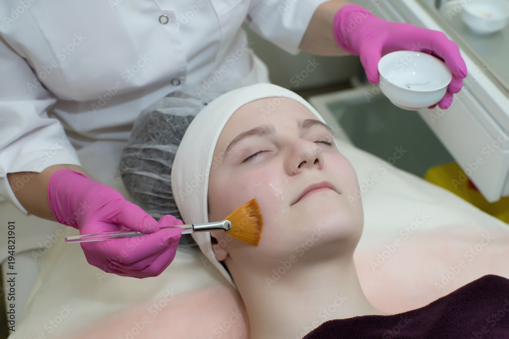 Naklejka premium Cosmetology, face peeling.