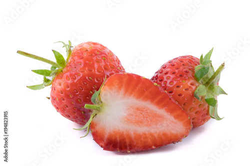 Perfectly retouched fresh strawberry fruit with sliced half isolated on white background. One of the best isolated strawberries you have seen. Selective focus