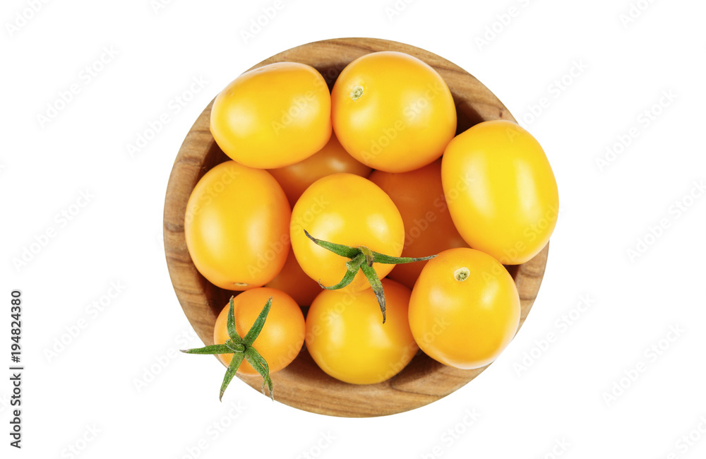 yellow tomatoes in a plate isolated