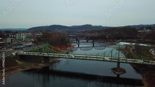 Aerial shot of a bridge as cars drive across it. photo