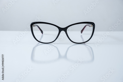 black glasses on white table