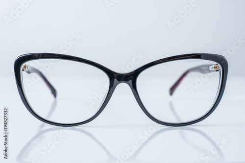 black glasses on white table