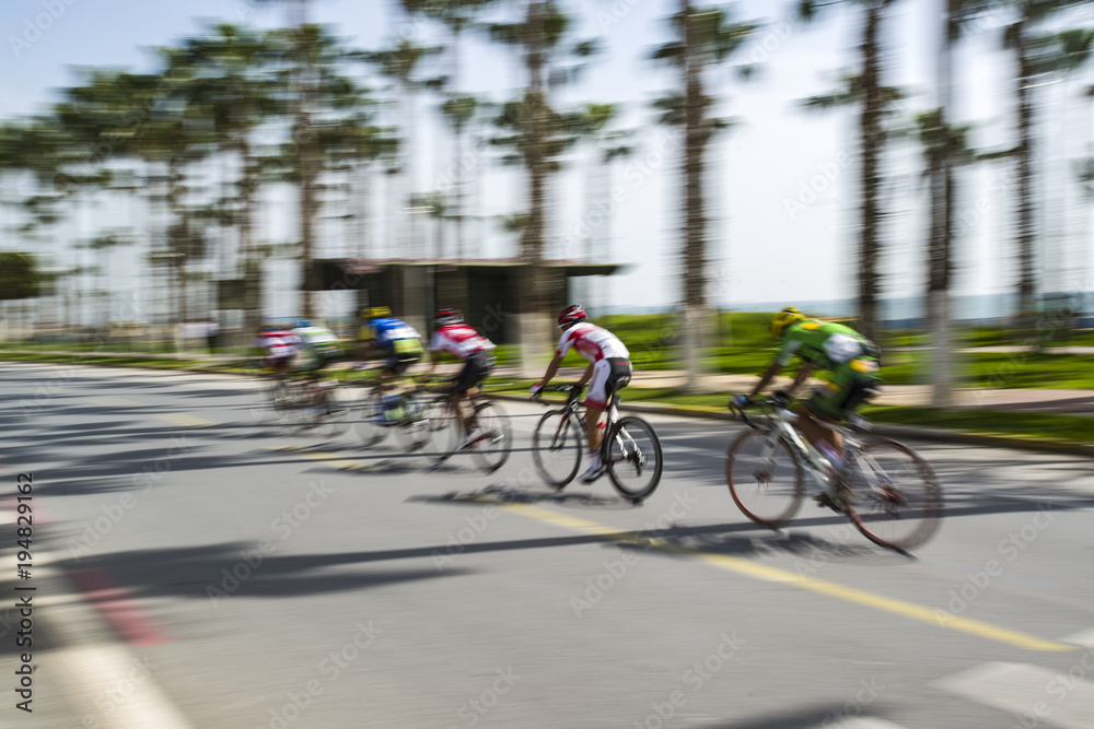Obraz premium Competition cycling race on the road. Motion blur photo