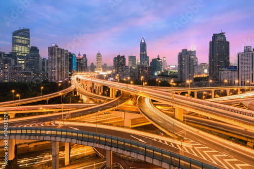 Beautiful Shanghai city with interchange overpass at nightfall in Shanghai, China.