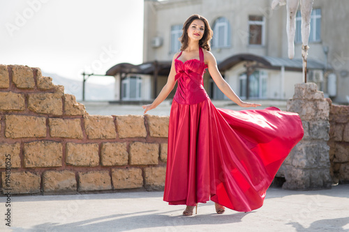 Beautiful woman in a red dress © Evgenia Tiplyashina