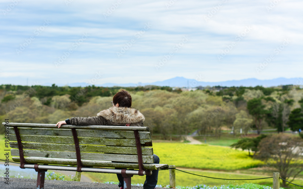 One person sitting on bench in the park, , Hitachi Seaside Park, Japan