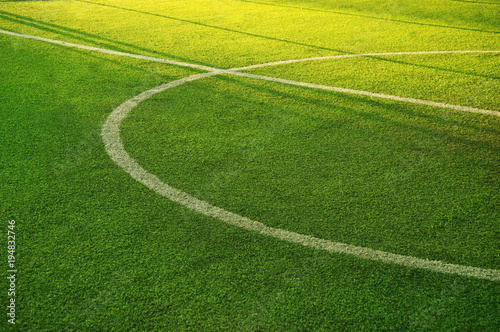 white circle line on green grass of football of soccer sport field background