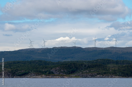 Windmill farm on the island of Hitra in Norway. Hitra Wind Farm is a 24-turbine wind farm located in the municipality of Hitra in Trondelag county, Norway.  © bphoto