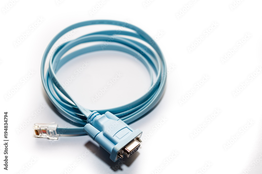 blue network cable with RJ45 connectors for conecting long distance communication closer on white background. blue network cable with RJ45 connectors for conecting long distance communication closer on white background.