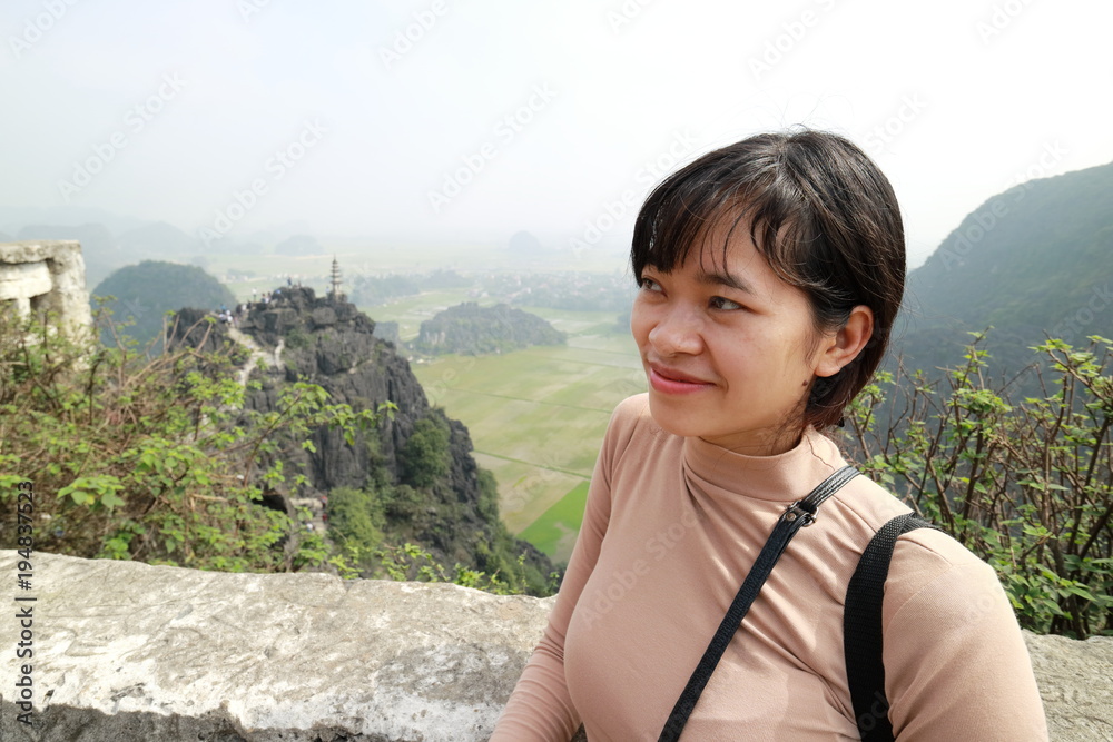 The woman traveling in Hang Mua,Tam coc, Ninh Binh,Vietnam The woman traveling in Hang Mua,Tam coc, Ninh Binh,Vietnam
