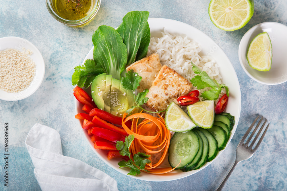 vegan lunch bowl salad with roasted tofu cheese, avocado, rice, cucumber, bell pepper, carrot and pak choi vegan lunch bowl salad with roasted tofu cheese, avocado, rice, cucumber, bell pepper, carrot and pak choi