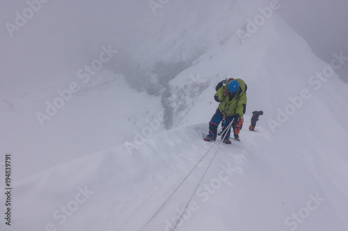 Climbers climbing with ropes in line, Island Peak, Everest Region, Nepal