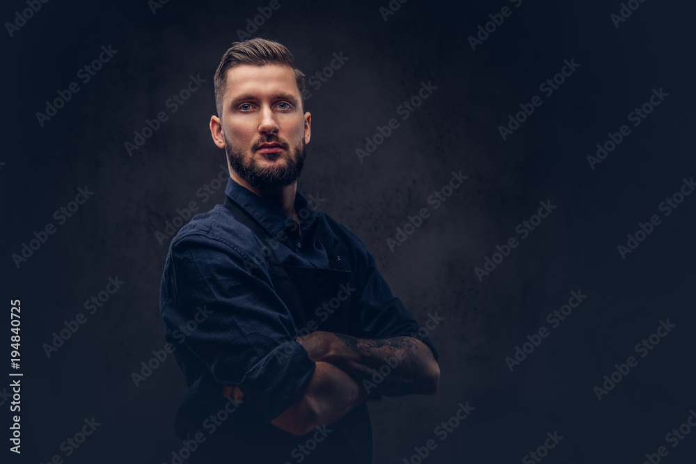 Studio portrait of a professional bearded butcher with hairstyle Studio portrait of a professional bearded butcher with hairstyle