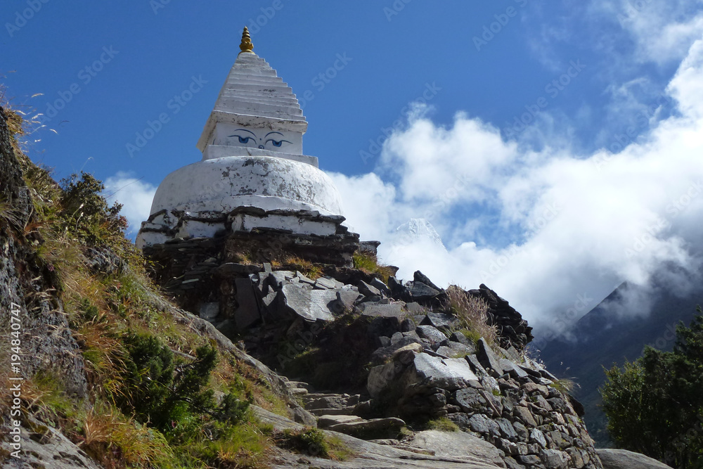 Stupa (shrine) over a blue sky with clouds, Pangboche, Everest Base Camp trek, Nepal