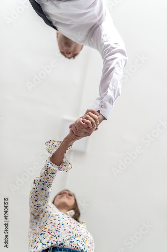 Bottom view of a handshake of a businessman and woman