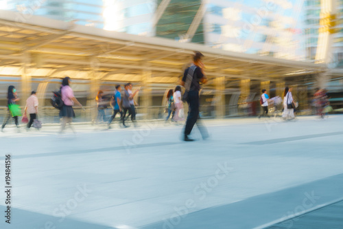 People walking in motion blur in the city