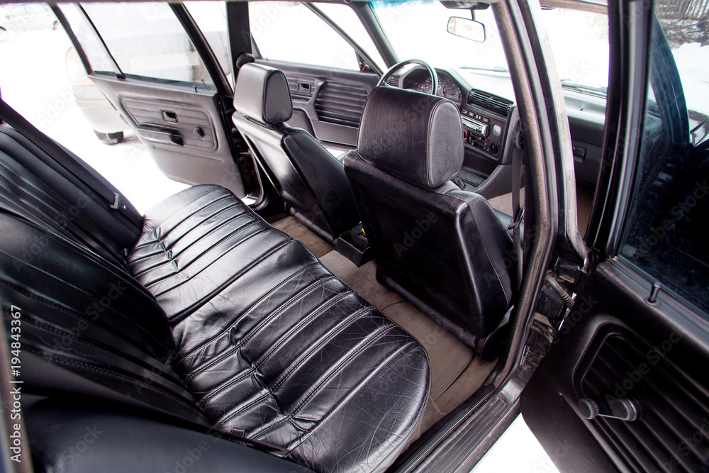 Black leather rear seats of retro car Black leather rear seats of retro car