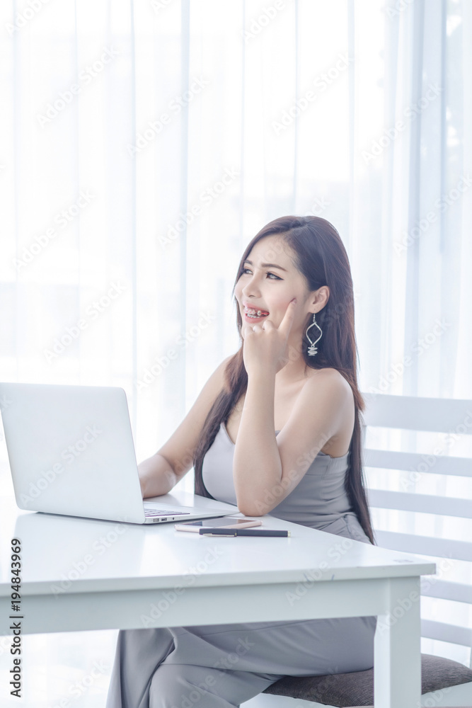 Business woman thinking and work with laptop Business woman thinking and work with laptop