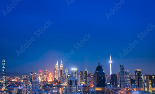Cityscape of Kuala lumpur city skyline at night in Malaysia.
