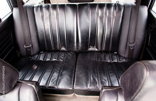 Black leather rear seats of retro car